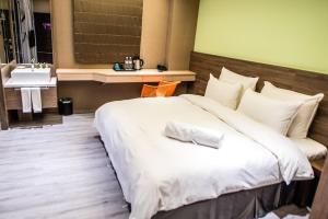 Letto o letti in una camera di SIX FUKUN HOTEL
