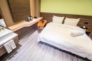 Letto o letti in una camera di SIX FUKUN HOTEL