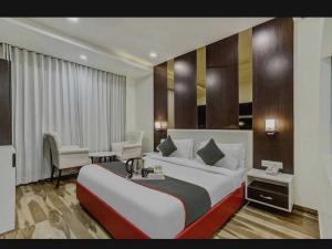 Postel nebo postele na pokoji v ubytování Super Hotel O Raas Near Near Paschim Vihar