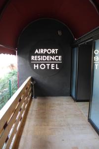 an entrance to an airport residence hotel with a sign on the wall at Airport Residence in Istanbul