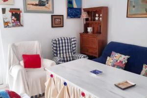 a living room with two chairs and a table at Charming apartment in El Rompido with sea view in El Rompido