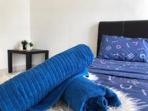 Una cama o camas en una habitación de Ampang 4-6 pax in Ampang Point