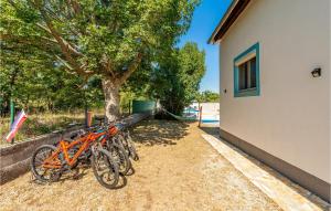 a group of bikes parked next to a building at Holiday Home Podgradina 01 in Gradina