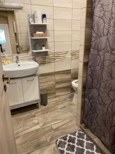 Kúpeľňa v ubytovaní Aranyfürt Apartmanház