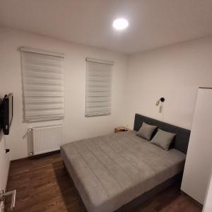 Postel nebo postele na pokoji v ubytování APARTMAN studio DADO