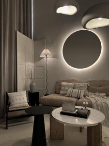 a living room with a couch and a table at Cozy Ins Duplex EkoCheras 1-6pax in Kuala Lumpur