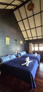 Postel nebo postele na pokoji v ubytování Ko Phangan Beach Cottages