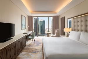 Televizors / izklaižu centrs naktsmītnē Dusit Doha Hotel