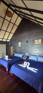 Postel nebo postele na pokoji v ubytování Ko Phangan Beach Cottages