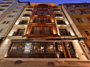 a facade of a building with a store front at Sanat Boutique Hotel Pera in Istanbul