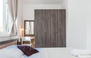 Postel nebo postele na pokoji v ubytování Apartment Grebastica Lxxxviii