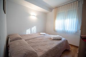 En eller flere senge i et værelse på Apartamento primera linea de mar