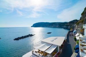a view of a body of water with a group of buildings at Hotel Casa Celestino in Sant'Angelo D'Ischia