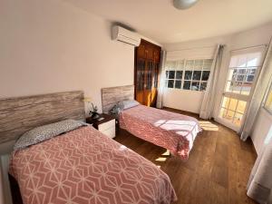 Łóżko lub łóżka w pokoju w obiekcie Villa Casa Vega Fuengirola