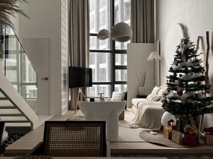 a living room with a christmas tree in it at Cozy Ins Duplex EkoCheras 1-6pax in Kuala Lumpur +49 photos