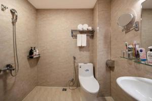 a bathroom with a toilet and a sink at A25 Hotel - 80 Mai Hắc Đế in Hanoi