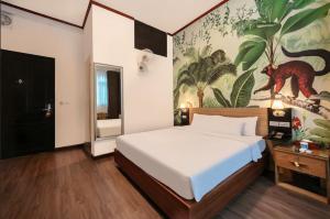 Postel nebo postele na pokoji v ubytování A25 Hotel - 80 Mai Hắc Đế