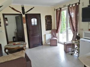 a living room with a couch and a table at Sun Village Domki in Stegna