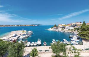 a group of boats are docked in a harbor at Three-Bedroom Holiday Home In Sibenik in Šibenik