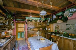 a kitchen with a table and some pots and pans at Pri Macku in Tolmin