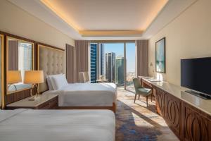 Gulta vai gultas numurā naktsmītnē Dusit Doha Hotel