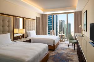 Gulta vai gultas numurā naktsmītnē Dusit Doha Hotel