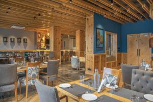 a dining room with a table and chairs at Echor Mandara TreeVilla Dharamshala in Dharamshala