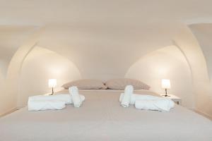 Postel nebo postele na pokoji v ubytování Rifugio storico a 50 passi dal Duomo, Bilocale