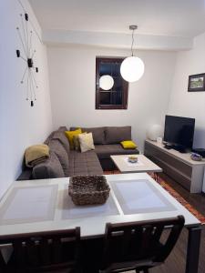 a living room with a couch and a table at Sweet Home Vlasic in Vlasic