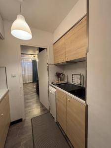 a kitchen with a sink and a counter top at Studio cosy 5 personnes aux pieds des pistes. in Le Dévoluy