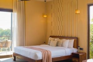 ELIVAAS Cows & Cuddles 4 BHK with Pvt Pool and Garden客房内的一张或多张床位