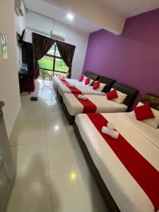 Voodi või voodid majutusasutuse Max Ferringhi Hotel toas