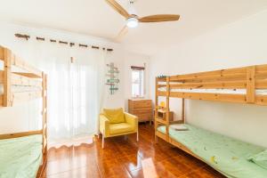 Ένα ή περισσότερα κρεβάτια σε δωμάτιο στο Baleal Happiness Surf House