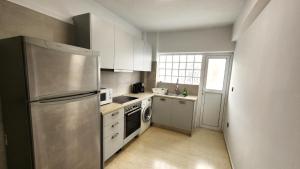 Kuchyň nebo kuchyňský kout v ubytování Grec Maison Piraeus by GrecCollection