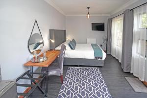 Ένα ή περισσότερα κρεβάτια σε δωμάτιο στο The Chameleon Stay @107