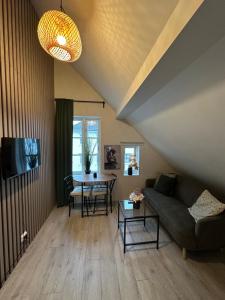a living room with a couch and a table at A Place To Stay Stavanger, apartment 3 in Stavanger