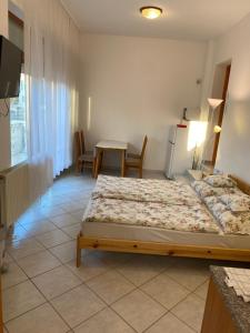 Postel nebo postele na pokoji v ubytování Csók Apartmanház