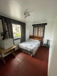 Postel nebo postele na pokoji v ubytování Hostal Valle Norte