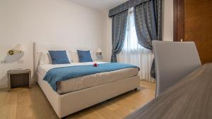 Posteľ alebo postele v izbe v ubytovaní Hotel Luna