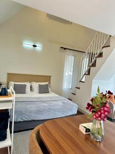 a bedroom with a bed and a staircase at Wakaf Tengah Cottage with pool near MRSMKT IPG UMT UNISZA , Kuala Nerus in Kuala Terengganu +73 photos