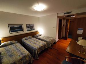 Posteľ alebo postele v izbe v ubytovaní Hotel Luna