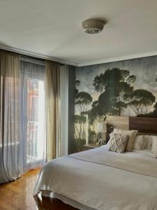Ένα ή περισσότερα κρεβάτια σε δωμάτιο στο Apartamentos San Antonio