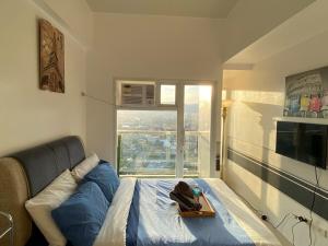 a room with a bed with a tray on it at Twilight25 Condo in Cebu City