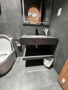 a bathroom with a sink and a toilet at Wabi Homes in Buon Ma Thuot +21 photos