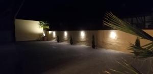 a dark room with a wall with a tree and lights at Dreiländereck-Ferienwohnung in Eschbach in Eschbach