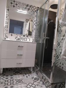 a bathroom with a shower and a sink and a mirror at Appartement la défense Courbevoie in Courbevoie +24 photos