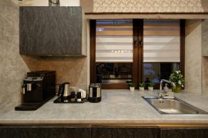 Kuchyň nebo kuchyňský kout v ubytování Finlandia Chalet + 15 fotografií