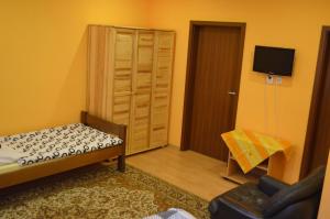 מיטה או מיטות בחדר ב-Apartment Sučany