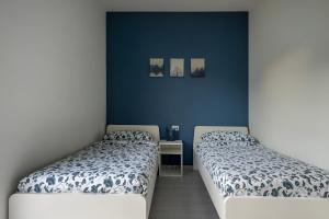 Postel nebo postele na pokoji v ubytování Happy Guest Apartments - Blue Apartment