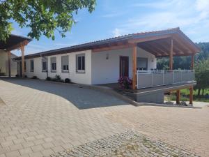 a rendering of a house with a pavilion at Ferienwohnungen Meyer in Heilsbronn